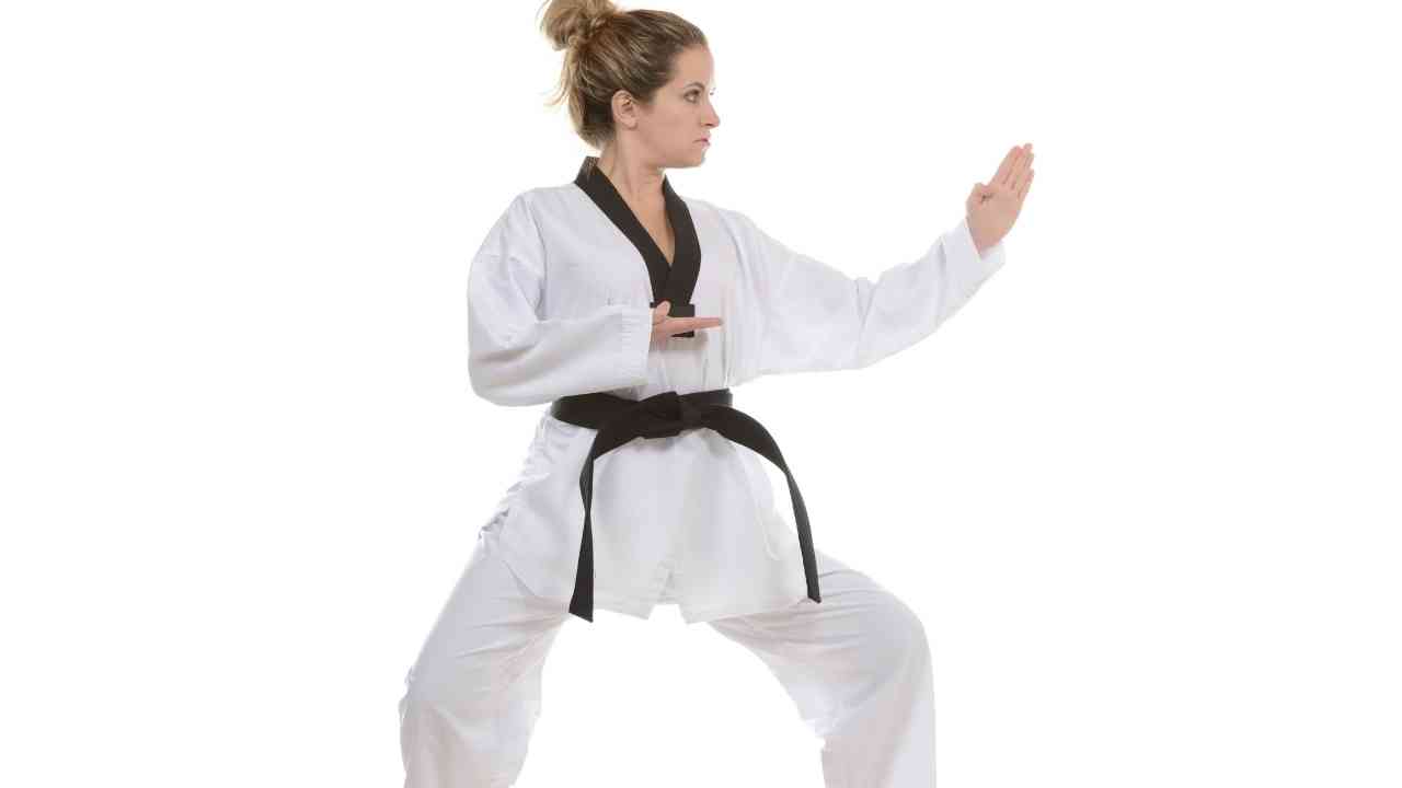 what is taekwondo: a women practicing taekwondo