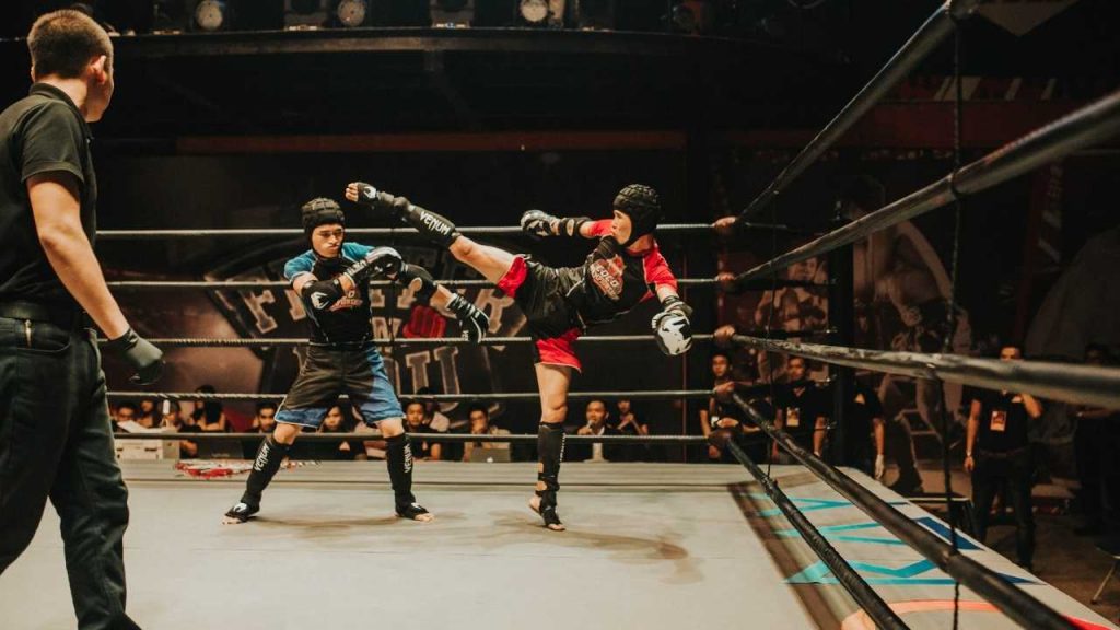 two boxers fighting in a boxing ring